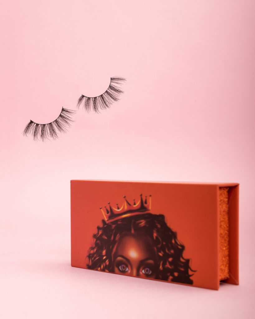 eye lashes with an orange box on a pink background